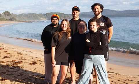 six young people standing on the beach at canteen's first nations cultural program