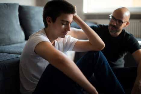 Son discussing cancer with his Father