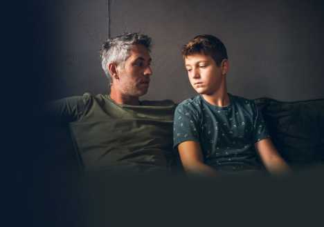 Father talking to son about cancer