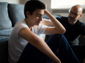Son discussing cancer with his Father