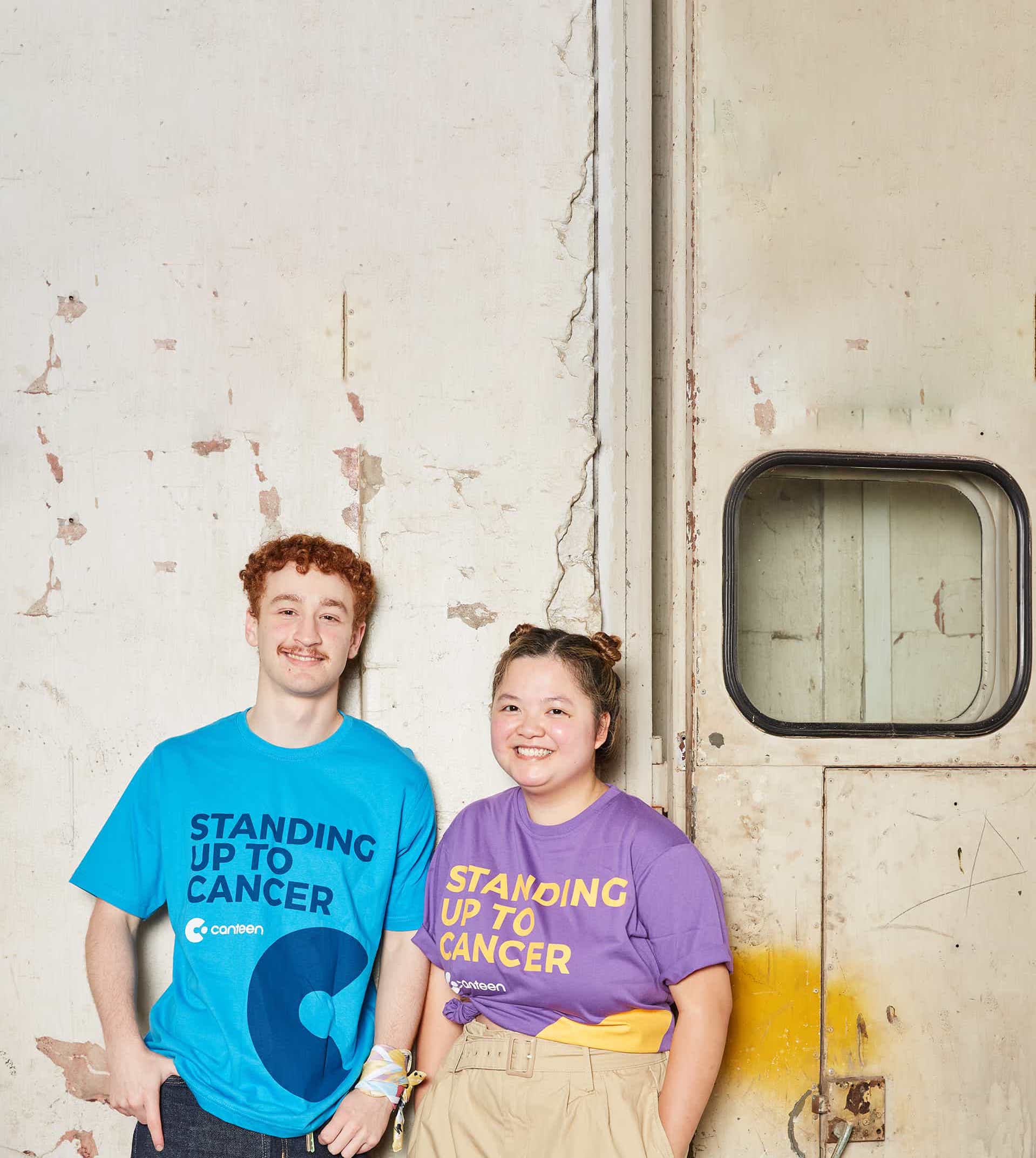 two young people wearing canteen shirts