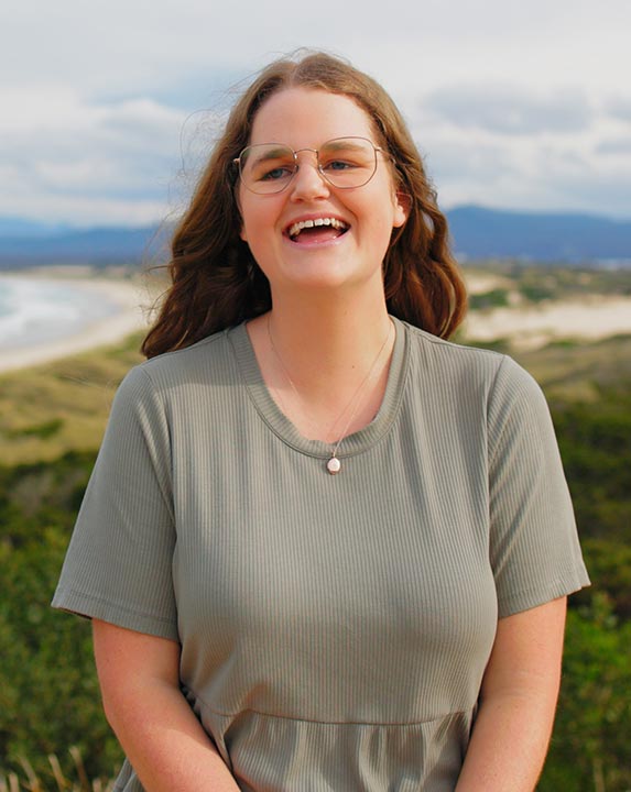 Georgia, a young who found friendship through Canteen after connecting with others in the same boat, looking into the camera