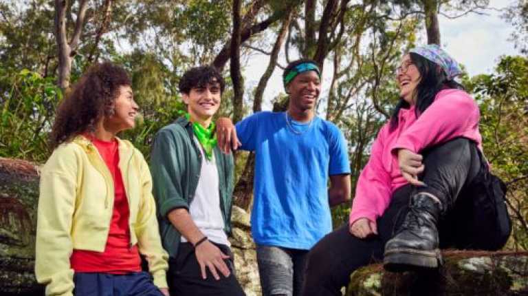 image of young people outside in the bush wearing canteen bandannas