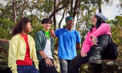 image of young people outside in the bush wearing canteen bandannas