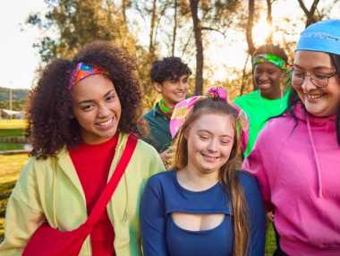 a group of 5 young people wearing bandannas