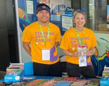 image of two people selling bandannas 