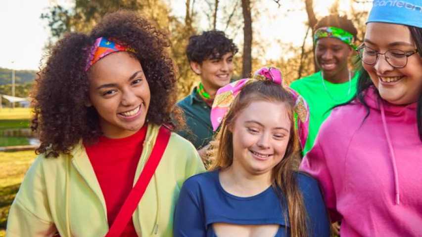 a group of 5 young people wearing bandannas